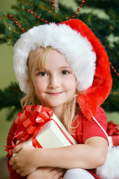 Girl in santa cap Stock Picture