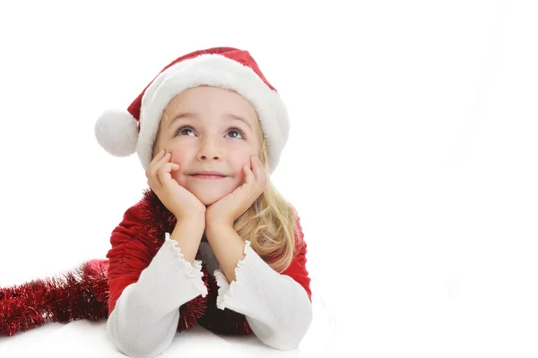 Mädchen mit Weihnachtsmütze lizenzfreie Stockbilder