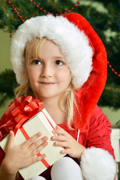 Girl in santa cap Royalty Free Stock Photos