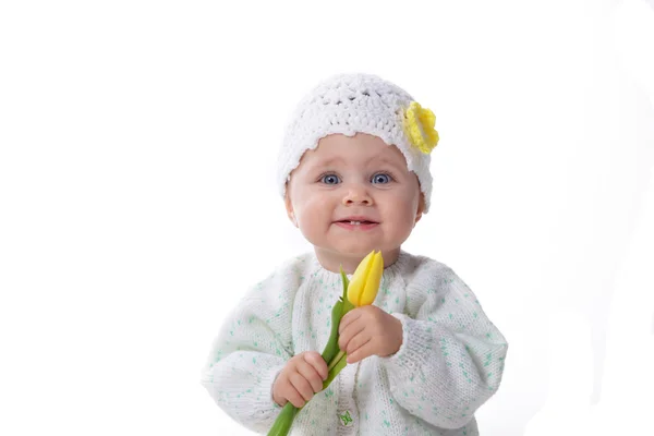 Babymeisje met tulp — Stockfoto