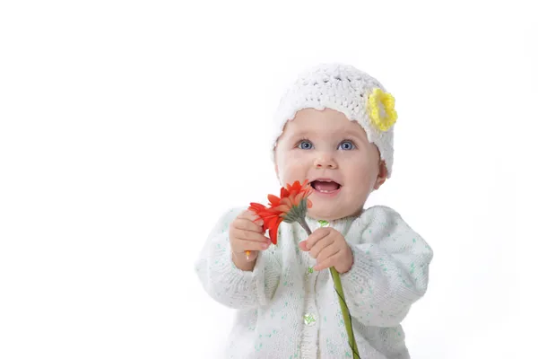 Baby girl with red flower — Stock Photo, Image