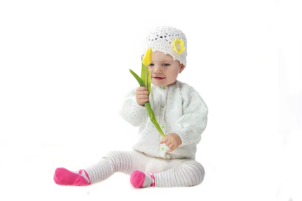 Baby girl with tulip — Stock Photo, Image