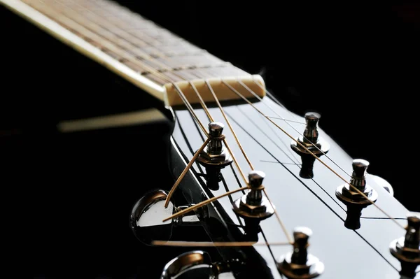 Neck of black guitar — Stock Photo, Image