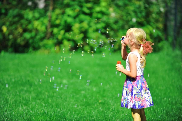 Girl with bubble blower — Stock Photo, Image