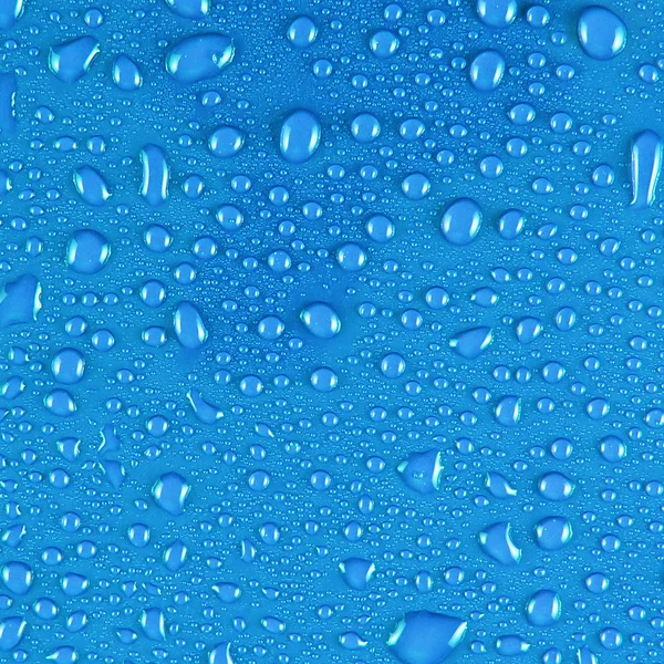 Kapky vody na modré — Stock fotografie