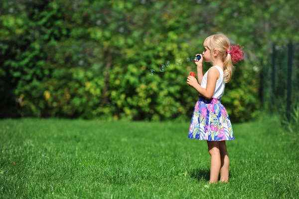 Girl with bubble blower — Stock Photo, Image