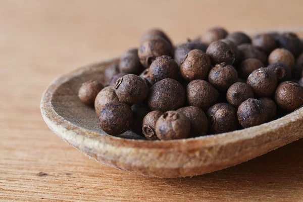 Allspice in spoon — Stock Photo, Image