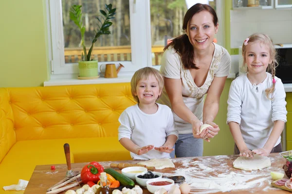 Mother with children cooking — Stock Photo, Image
