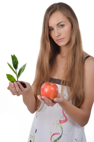 Woman with green sprout and apple — Stock Photo, Image