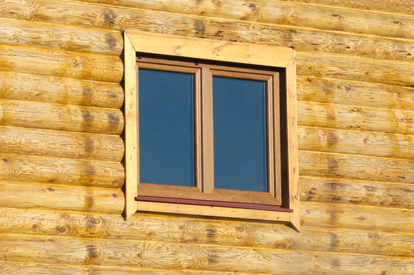 Wood logs house wall with window — Stock Photo, Image