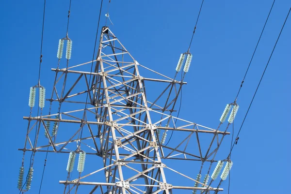 Top section of high-voltage power line metal tower — Stock Photo, Image