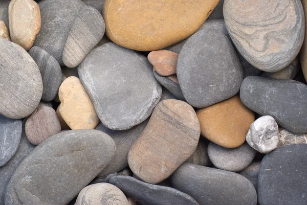 ビーチのクローズ アップの多くの滑らかな海石 — ストック写真