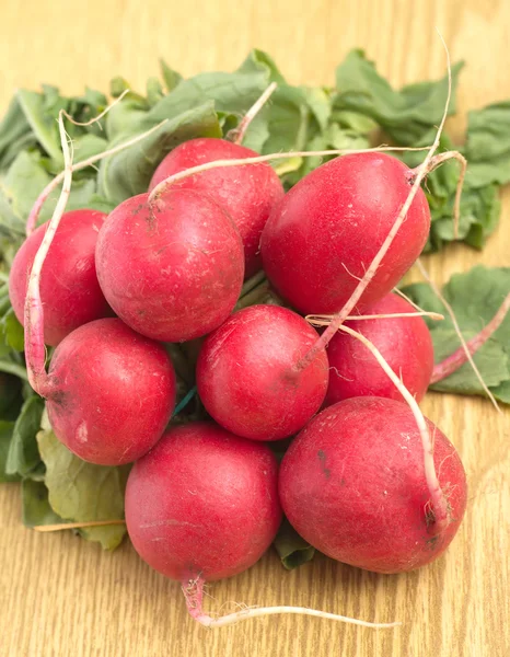 Bunch of radish on brown desk — Stock Photo, Image