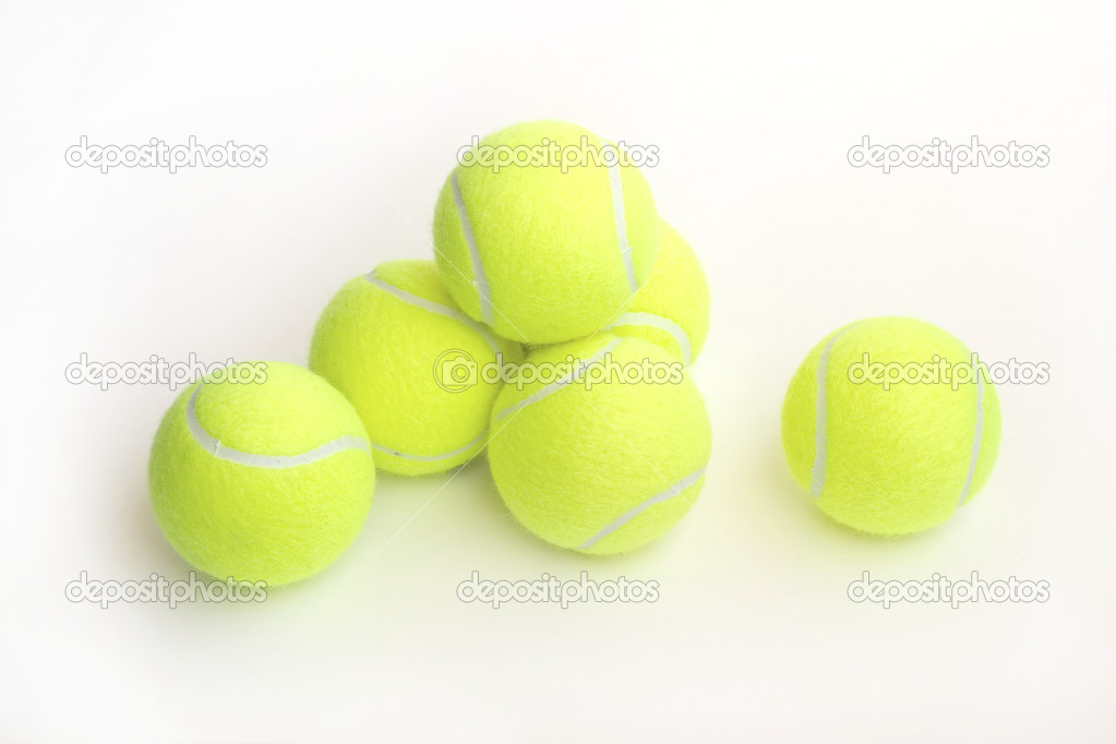 Yellow tennis balls on white closeup