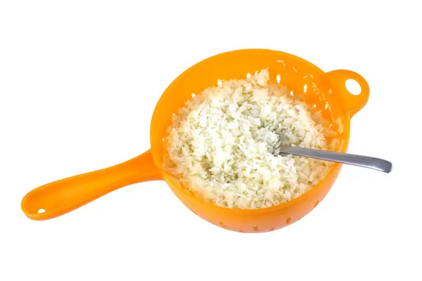 Rice in colander isolated closeup — Stock Photo, Image