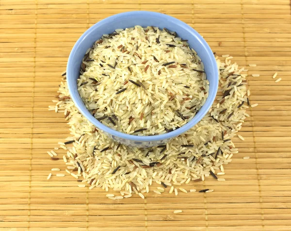 Rice in bowl on starw mat — Stock Photo, Image