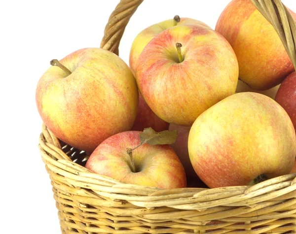 Ripe apples in basket isolated closeup — Stock Photo, Image