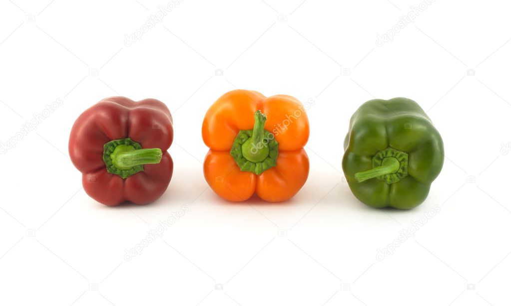 Three color bell peppers isolated close up