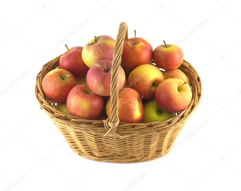 Ripe fruits and apples in wicker basket isolated