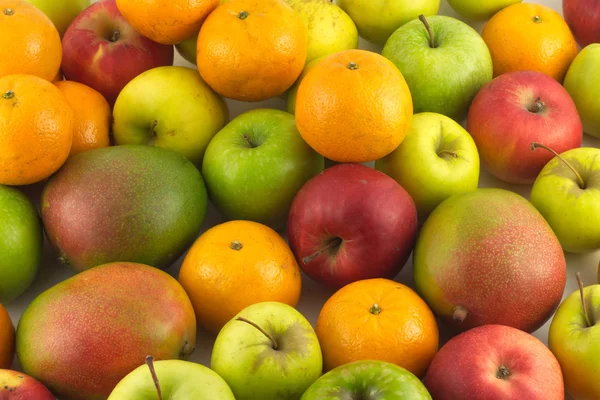Muchas frutas maduras como primer plano de fondo —  Fotos de Stock