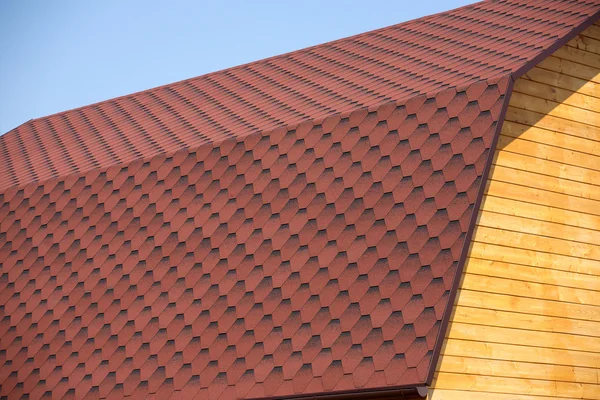 Wooden house wall and brown roof tile closeup — Stock Photo, Image