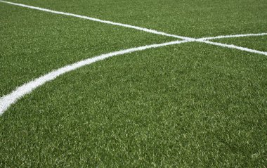 bir futbol sahası suni çim yeşil ve beyaz çizgili bir parçası