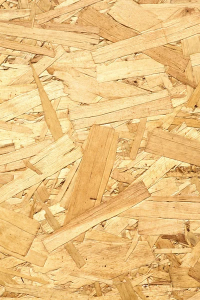 Wooden panel made of pressed wood shavings vertical — Stock Image Wooden panel made of pressed wood shavings vertical Royalty Free Stock Images