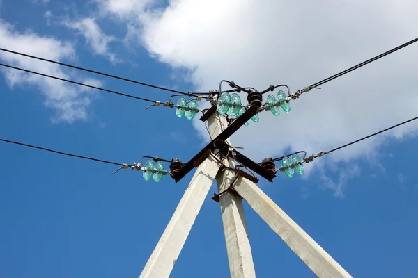 Prop of power supply line over blue sky with white clouds — Stock Photo, Image