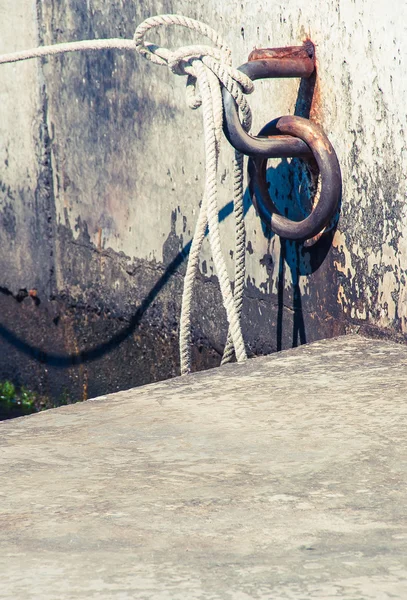 Anchor rope in sea harbor