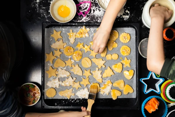 Children Put Cookies Baking Sheet Cooking Different Forms Cookies Holiday — Stock Photo, Image