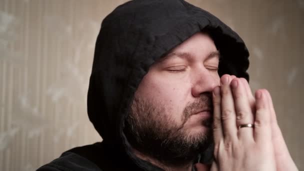 Middle Aged Man Prays God Unshaven Man Hood His Head — Vídeo de Stock