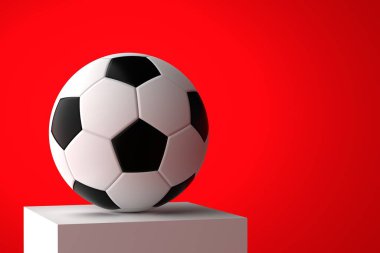 Kırmızı arka planda beyaz bir kaidede futbol topu. Futbol yarışması, şampiyonluk konsepti. Metin için yer.