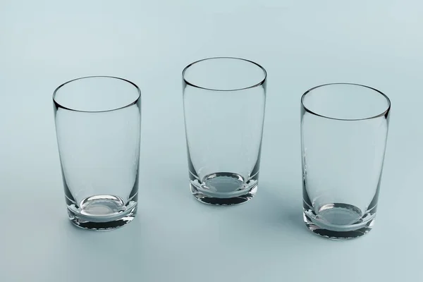 Three Empty Glass Beakers Blue Background — Stock Photo, Image