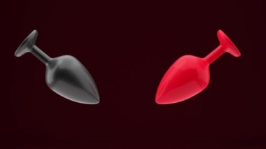 Anal tıkaçlar. Siyah ve kırmızı, koyu kırmızı arka planda dönerler. Yetişkinler için özel oyuncaklar