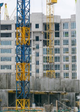 Construction crane at the construction site. Building under construction.