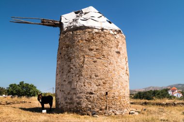 Traditional old windmill located at Naxos island, Greece clipart