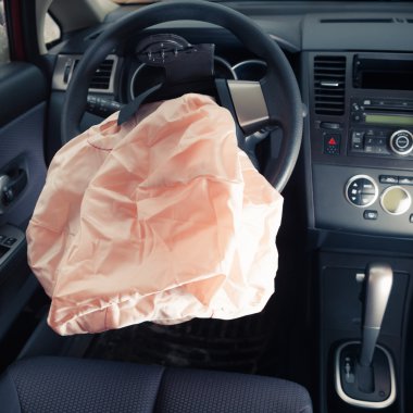 Airbag explodes on steering wheel clipart