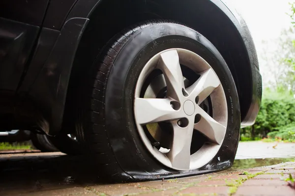 Damaged flat tire — Stock Photo, Image