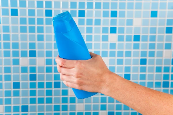 Hand holding shower gel — Stock Photo, Image