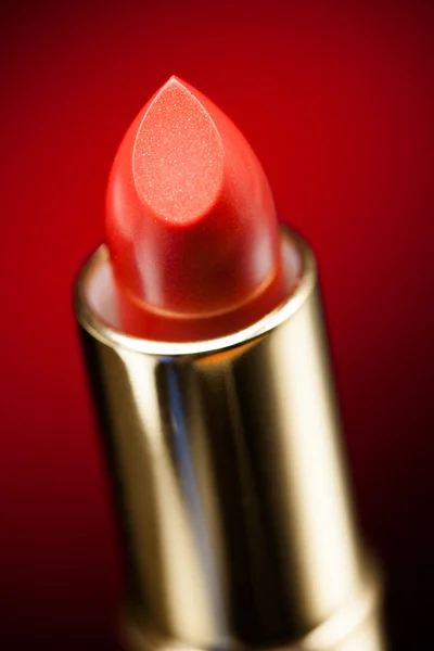 Lipstick on red background — Stock Photo, Image