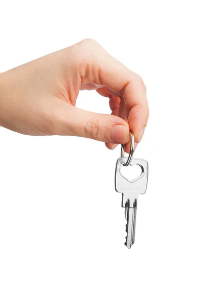 Hand holding key isolated on white — Stock Photo, Image