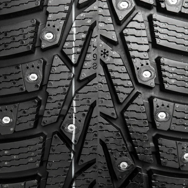 Protector and snow spikes of winter tire — Stock Photo, Image