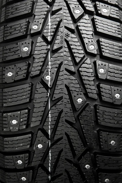 Protector and snow spikes of winter tire — Stock Photo, Image