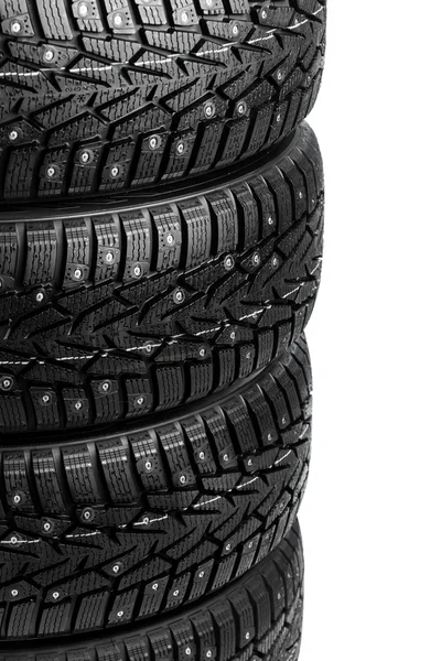 Winter tires stack isolated on white — Stock fotografie