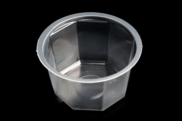 Plastic container isolated on black — Stock Photo, Image