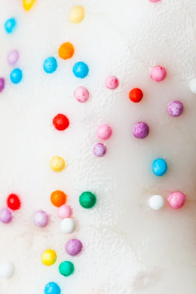 Donut sprinkles background, close-up view — Stock Photo, Image
