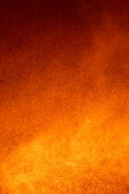 parçacıklarla soyut turuncu arkaplan