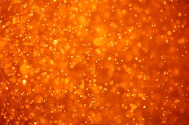 Abstract orange background with particles clipart