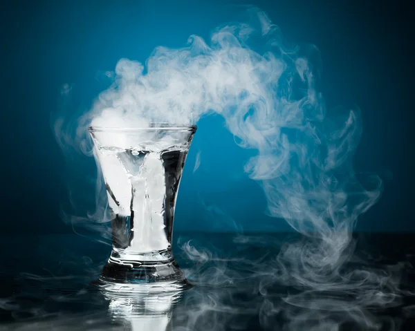 Shot glass of vodka with ice vapor — Stock Photo, Image