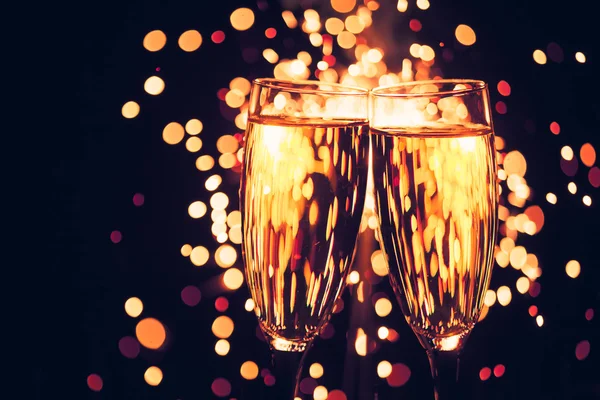 Champagne glass against christmas sparkler background — Stock Photo, Image